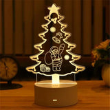 Acrylic LED night light with etched Christmas tree design on a lit base