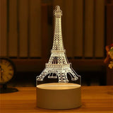 Acrylic night light with etched Eiffel Tower design glowing warm