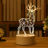 Acrylic LED night light with etched reindeer design on a lit wooden base
