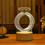 Acrylic LED night light with etched ring and circle design glowing warm