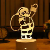 Acrylic LED night light with etched Santa Claus design on a lit base