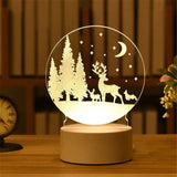 Acrylic night light with etched winter forest and moon scene in a round panel