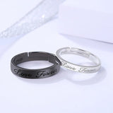 Black and silver couple ring pair displayed on a lavender background