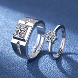 Silver couple rings with blue stone accents displayed on a blue background