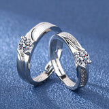 Silver angel and demon couple rings shown closer on a deep blue background