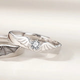 Silver angel and demon couple rings shown front facing together