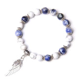 Navy and white speckled stone beads on bracelet with dangling silver angel wing charm