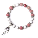 Pink and white natural stone bead bracelet with silver angel wing charm