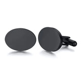 Matte black flat round cufflinks shown at an angle with silver swivel backs
