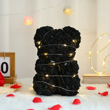 Black rose flower teddy bear with LED fairy lights and red rose petals