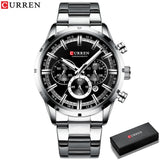 Silver steel chronograph watch with a light silver dial beside a black box