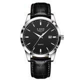 Silver case watch with black dial and black leather strap front facing view