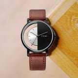 Black case watch with half hollow cutaway dial and brown leather strap