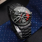 Black car wheel style watch worn on wrist against a navy shirt and tie background