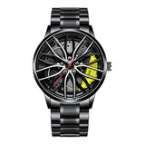 Black stainless steel car wheel watch with yellow caliper accent on white background