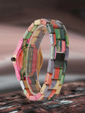 Colorful bamboo wood watch shown from a side profile angle