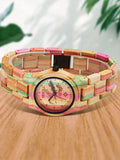 Colorful bamboo wood watch shown front facing on a wooden table