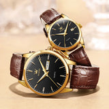 Gold black dial couple watches with brown leather straps coiled together