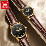 Gold black dial couple watches with brown leather straps resting on a wooden surface