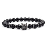 Black matte onyx bead bracelet with black tone wolf head charm