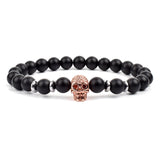 Black matte onyx bead bracelet with gold crown charm