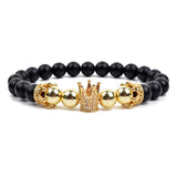 Black matte onyx bead bracelet with double gold crown charms