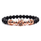 Black matte onyx bead bracelet with double rose gold crown charms