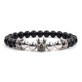 Black matte onyx bead bracelet with silver crown charm and beaded accents