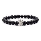 Black matte onyx bead bracelet with silver crown charm and gemstone accent