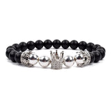 Black matte onyx bead bracelet with double silver wolf head charms
