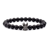 Black matte onyx bead bracelet with small silver crown charm