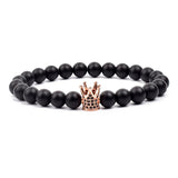 Black matte onyx bead bracelet with white gold toned crown charm