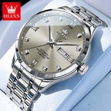 Two-tone silver and gold watch with white dial and day date window on light background
