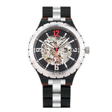Dark wood skeleton watch with silver dial and steel accents on a white background