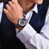 Person in a striped shirt and blazer wearing the blue accent wooden wristwatch