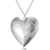Silver heart locket with etched floral scroll pattern on a fine silver chain