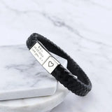 Black braided leather bracelet with engraved silver plate shown at an angle