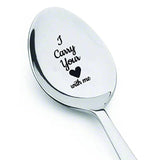 Engraved silver spoon reading I carry your heart with me with small heart motif