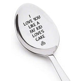 Stainless steel spoon engraved with the message I love you like a fat kid loves cake