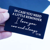 Hand holding matte black metal wallet card engraved In case you need a little reminder, I love you now and always