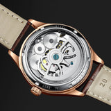 Rose gold watch caseback with exhibition window showing automatic movement rotor
