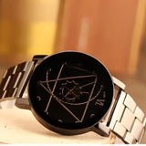 Close view of black watch with rose gold geometric compass line dial