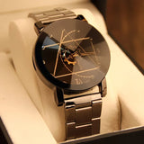Black steel watch with geometric line dial displayed on a cushion