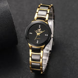 Gold and black ceramic watch with rhinestone dial shown at an angled close up