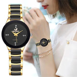 Woman wearing the gold and black rhinestone watch paired with a matching necklace