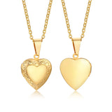 Two gold heart shaped photo lockets on chains, one engraved and one plain