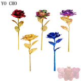 Multiple gold plated roses in red, blue, purple, and gold displayed together