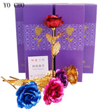 Red gold plated rose displayed beside a purple gift box packaging