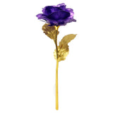Purple gold plated rose with gold stem and leaves on white background