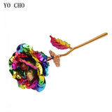 Rainbow multicolor gold plated rose with gold stem and leaves on white background